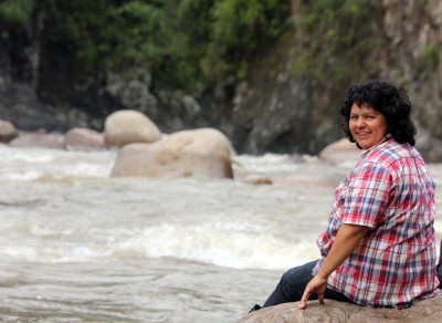 Berta Cáceres stands at the Gualcarque River in the Rio Blanco region of western Honduras where she, COPINH (the Council of Popular and Indigenous Organizations of Honduras) and the people of Rio Blanco have maintained a two year struggle to halt construction on the Agua Zarca Hydroelectric project, that poses grave threats to local environment, river and indigenous Lenca people from the region. Photo by Goldman Environmental Prize